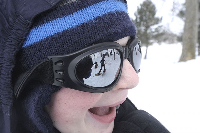 Andrew Phelan seventh-grade, watches his classmates snowshoe through Delaware Park. Students at Catholic Academy of West Buffalo learned to snowshoe with the help of the NYS Office of Parks and Recreation and Historic Prevention. 