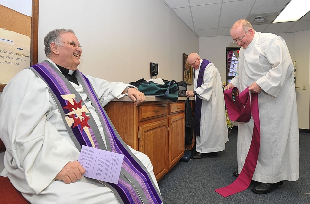 Father Thomas Quinlivan (right), pastor, Queen of Heaven and vicar forane for the Eastern Erie Vicariate, joins Father Daniel Palys (left), pastor, St. Gabriel Church, Elma, and Father David Borowiak (center), St. Philip Church, Cheektowaga as they all get ready for the vicariate penance service at St. John Vianney Church, Orchard Park.