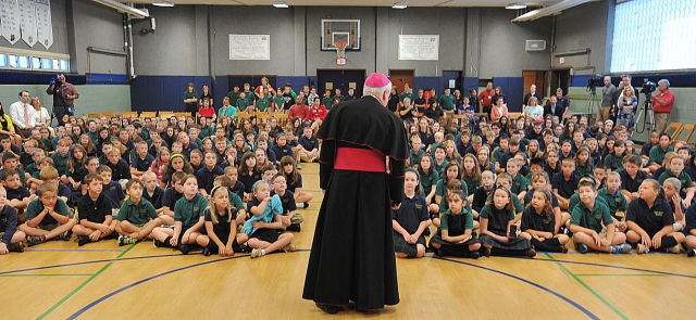 Bishop of Buffalo Richard J. Malone addresses the entire student body of Notre Dame Academy, Buffalo, on their first day of school.