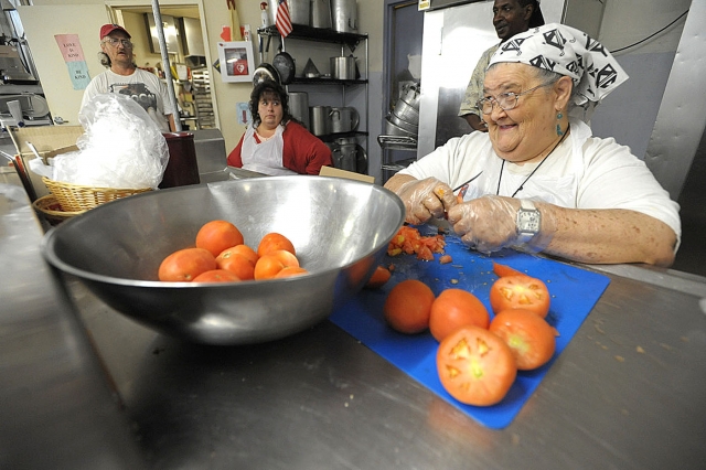 Geraldine Felt cuts tomatoes for the meal service at St. Luke's Mission of Mercy. Felt has been at St. Luke's since the start 20-years-ago. Amy Betros and Norm Paolini started St. Luke's to serve the poor of Buffalo's east side.