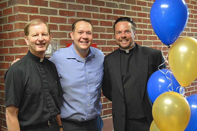 Father Greg Faulhaber, Pastor, Bob Owczarczyk, Seminarian, Father Dave Richards, Parochial Vicar, greet the students at Queen of Heaven School on the first day.