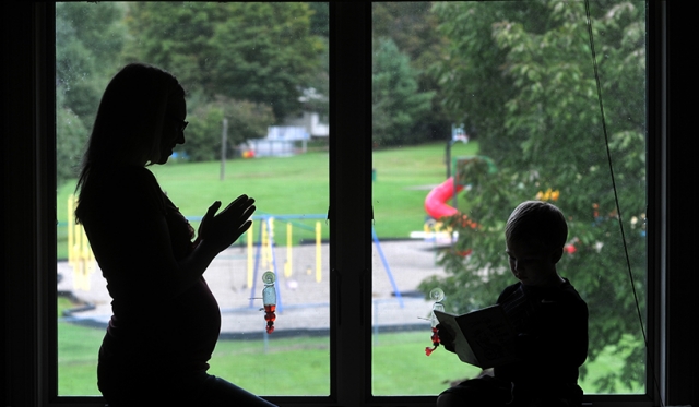 The Catholic belief in Respect Life causes extends to victims of domestic abuse. With the help of the Diocese of Buffalo, Angel (real name changed) found a home for herself and her son after leaving an abusive relationship. October is Respect Life month in the diocese. (Dan Cappellazzo/Staff Photographer)