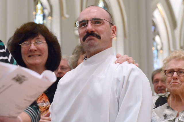 Peter Santandreu holds back tears during the opening procession of the Ordination of Deacons at St. Joseph Cathedral Sept. 16. Santandreu was ordained into the Diaconate by Bishop Richard J. Malone. (Patrick McPartland/Managing Editor)