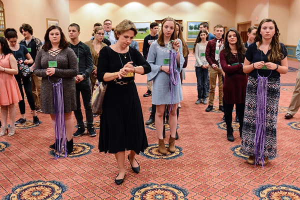 Immaculate Conception, East Aurora, Director of Youth Ministry Denise York checks the time as she prepares those participating in the closing liturgy procession. The liturgy closed the 66th annual Diocesan Youth Convention and was held over three days at the Adams Mark Hotel. (Patrick McPartland/Managing Editor)