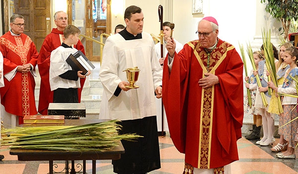 Bishop Richard J. Malone blessed the palms during Palm Sunday Mass at St. Joseph Cathedral. (Patrick McPartland/Managing Editor)